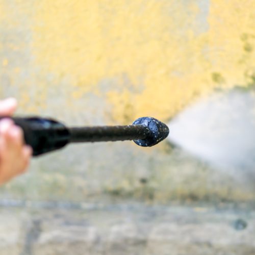 Cleaning,Dirty,Wall,With,High,Pressure,Water,Gun